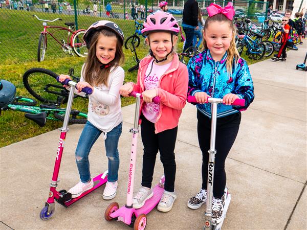 Students bike to school in the morning.